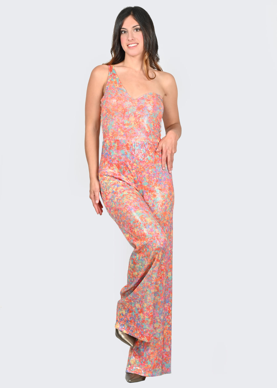 La tuta intera monospalla Lady è in paillettes con fantasia "Cristalli", proveniente da uno dei Dipinti Millyblu. Il modello è a vita alta con pantalone dalla linea scivolata e scollatura a cuore. La tuta intera elegante ha le coppe fisse ed è foderata.