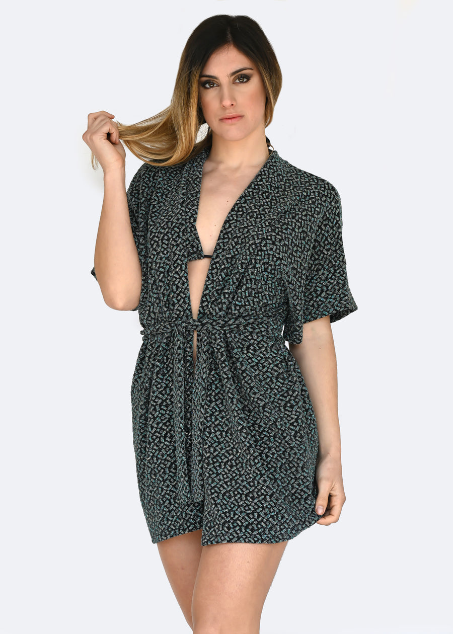 Cardigan in lurex verde a manica larga con cinta in vita. Confortevole, fresco e morbido. Comodo per le lunghe giornate estive anche come copricostume mare o fuori acqua.