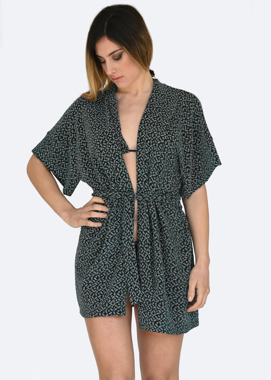 Cardigan in lurex verde a manica larga con cinta in vita. Confortevole, fresco e morbido. Comodo per le lunghe giornate estive anche come copricostume mare o fuori acqua.