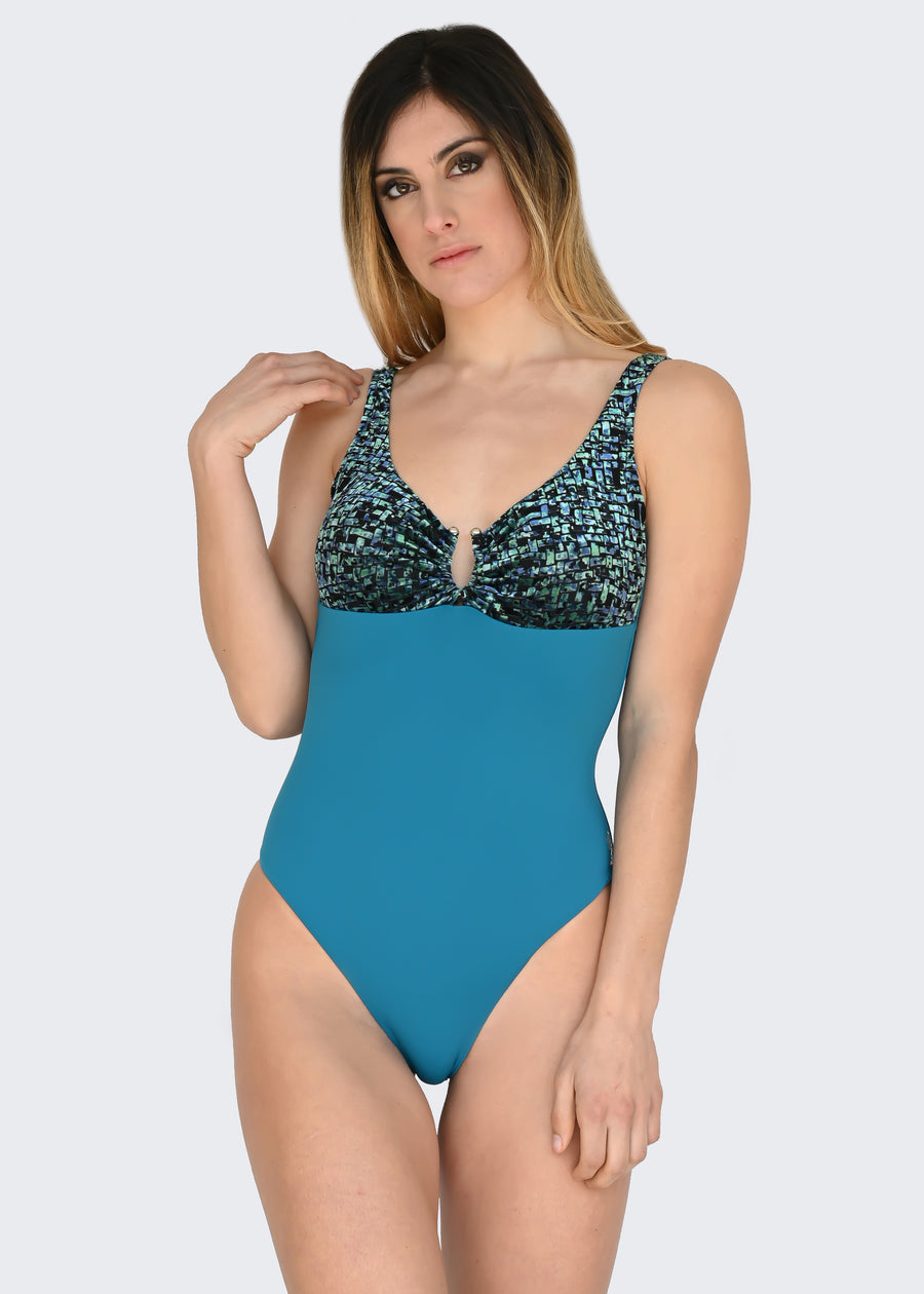Costume olimpionico in microfibra ottanio e velluto verde. Il costume intero ha lo scollo a V, anello lungo la scollatura, coppe estraibili e bretelline. I tessuti elastici sono confortevoli, permettendo una rapida asciugatura. Ideale come costume da bagno mare, piscina o body per gli outfit estivi.